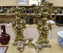 A pair of large candelabra decorated with cherubs height 82cm