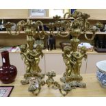 A pair of large candelabra decorated with cherubs height 82cm