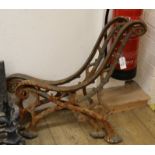 A pair of Victorian cast iron bench ends of rustic wood design W.65cm