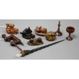 Three carved wood netsukes and sundry other treen, the netsukes including an embracing couple, a