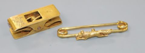 An early 20th century 18ct gold novelty double "peg" clip and a yellow metal fox brooch, brooch