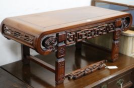 A Chinese carved hardwood low table (a.f.) W.92cm