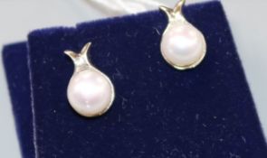 A pair of 18ct white gold and cultured pearl earrings.