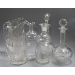 A pair of glass jugs, a pairs of decanters and a pair of decanters (missing stoppers)