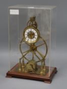 A skeleton clock, in perspex case