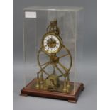 A skeleton clock, in perspex case