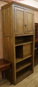 A late Victorian oak cupboard, fitted door and drawers W.100cm
