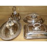 A quantity of plated wares including two tureens, two oval dishes, a cream jug and egg cruet