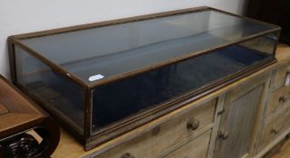 A table top display cabinet W.130cm