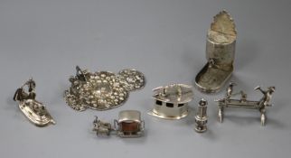 A group of miniature silver and white metal novelties, including a Spanish bullfighting group, a