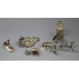 A group of miniature silver and white metal novelties, including a Spanish bullfighting group, a