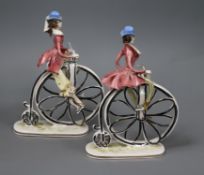 A pair of Italian pottery cyclists tallest 23cm