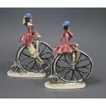 A pair of Italian pottery cyclists tallest 23cm