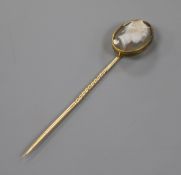 A 19th century yellow metal and sardonyx oval cameo stick pin, carved with the bust of Hermes to