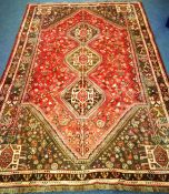 A Qashqai red ground carpet 265 x 175cm