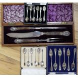 Three cased sets of silver spoons including grapefruit and a cased carving set.