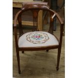 An Edwardian inlaid mahogany tub chair