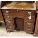 A George III mahogany kneehole desk W.77cm