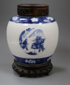 A Chinese blue and white ribbed jar, 18th / 19th century, later wood cover and stand height 20cm