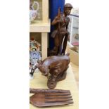 A teak figure of a man, a bull and a large spoon and fork fork length 87cm