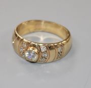 A 9ct gold and diamond set dress ring, size M.