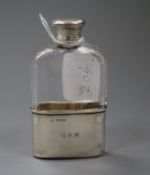 A Victorian silver mounted glass hip flask, with silver cup, London, 1871, lid a.f., 11.8cm.