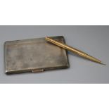 A 1930's engine turned silver cigarette case and a 9ct gold cased pencil.