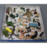 A collection of Britains farmyard animals and carts, etc.