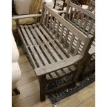 A teak garden bench with slatted seat W.128cm