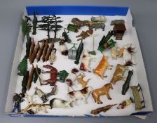 A collection of Britains farmyard animals, cows, fences, trees, hedges, etc.