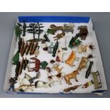 A collection of Britains farmyard animals, cows, fences, trees, hedges, etc.