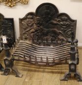 A cast iron fire-back, decorated with a lion rampant, together with a fire-back and fire dogs