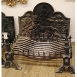 A cast iron fire-back, decorated with a lion rampant, together with a fire-back and fire dogs