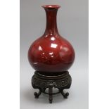 A Chinese Langyao bottle vase, Kangxi period, restored, wood stand height 29cm excl. stand