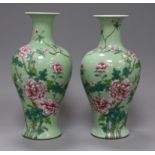 A pair of Chinese famille rose celadon ground vases height 25cm