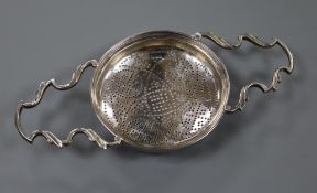 A George III silver lemon strainer, Thomas Wallis I?, London 1772, 20cm.