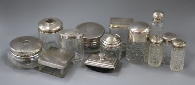 Thirteen assorted silver topped toilet jars etc. including one by Asprey & Co.