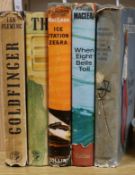 A small collection of books, including Ian Fleming, Goldfinger (1959, first edition) and The Man