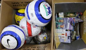 A collection of footballs signed by Premiership players and packaged Pro stars models