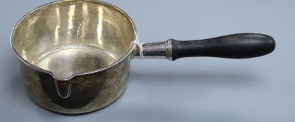 A 19th century French 955 standard white metal large brandy? pan, with ebonised handle, 33.8cm, 13.5