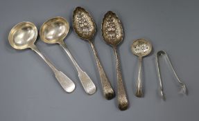 A pair of Georgian silver berry spoons, a pair of George IV silver sauce ladles, a silver sifter