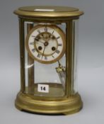 An oval four glass mantel clock height 21cm