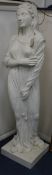 A Haddonstone reconstituted figure of a maiden, emblematic of Winter W.36cm at base