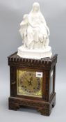 An Edwardian parian-topped oak mantel clock, figural mounts overall height 66cm