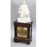 An Edwardian parian-topped oak mantel clock, figural mounts overall height 66cm