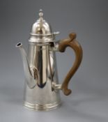 A Queen Anne style silver chocolate pot, London 1960, makers Tessiers Ltd, gross 24 oz.