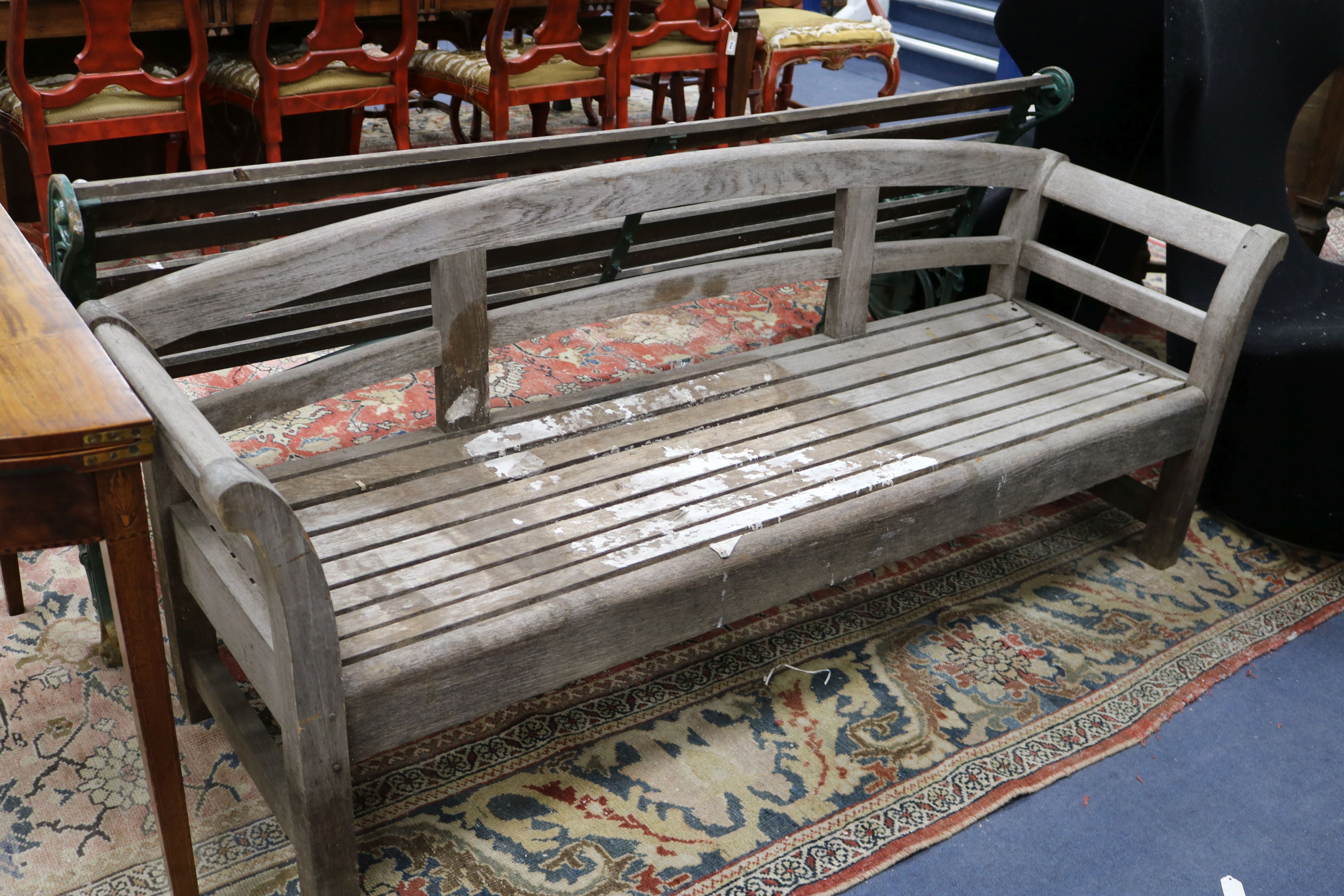 A Victorian green painted wrought iron and teak garden bench and a teak garden bench with slightly - Bild 2 aus 2