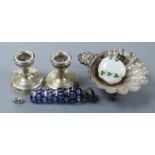 A quantity of silver including dwarf candlesticks, butter shell, two mounted scent bottles and a