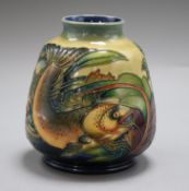 A Moorcroft vase, decorated with carp height 14cm