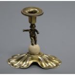 A continental gilt white metal and ivory set dwarf candlestick with figural stem, 10cm.